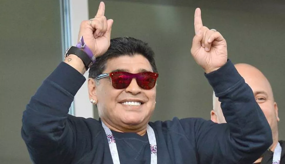 epa06812922 Argentinian soccer legend Diego Maradona is seen in the stands before the FIFA World Cup 2018 group D preliminary round soccer match between Argentina and Iceland in Moscow, Russia, 16 June 2018.(RESTRICTIONS APPLY: Editorial Use Only, not used in association with any commercial entity - Images must not be used in any form of alert service or push service of any kind including via mobile alert services, downloads to mobile devices or MMS messaging - Images must appear as still images and must not emulate match action video footage - No alteration is made to, and no text or image is superimposed over, any published image which: (a) intentionally obscures or removes a sponsor identification image; or (b) adds or overlays the commercial identification of any third party which is not officially associated with the FIFA World Cup) EPA/PETER POWELL EDITORIAL USE ONLY
