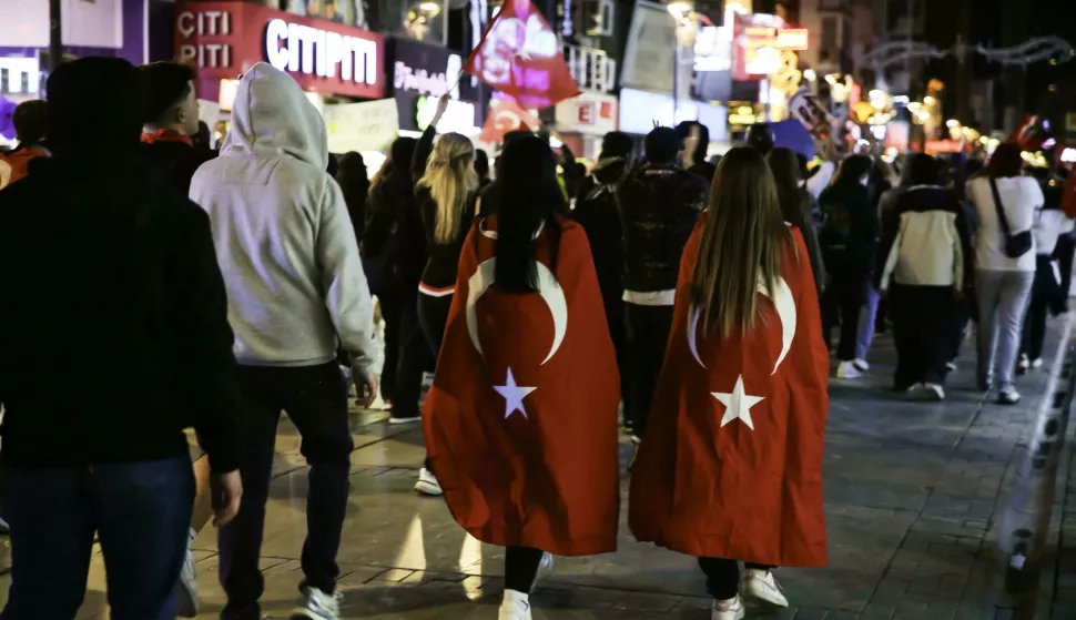 Two girls wear the flag of Turkey like a cape as Turkish people continue their protests against the arrest of Istanbul Mayor Ekrem Imamoglu in Izmir, Turkey, on March 27, 2025. Photo by Berkcan Zengin/Middle East Images/ABACAPRESS.COM Photo: Middle East Images/ABACA/ABACA