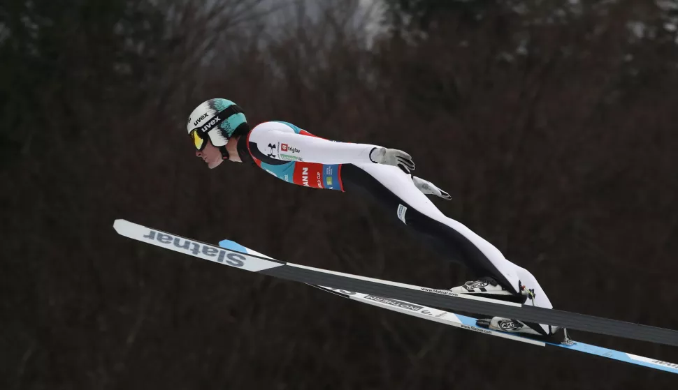 epa11995255 Domen Prevc of Slovenia soars through the air during the first round of the Men's Individual Ski Flying HS240 in Planica, Slovenia, 25 March 2025. EPA/ANTONIO BAT