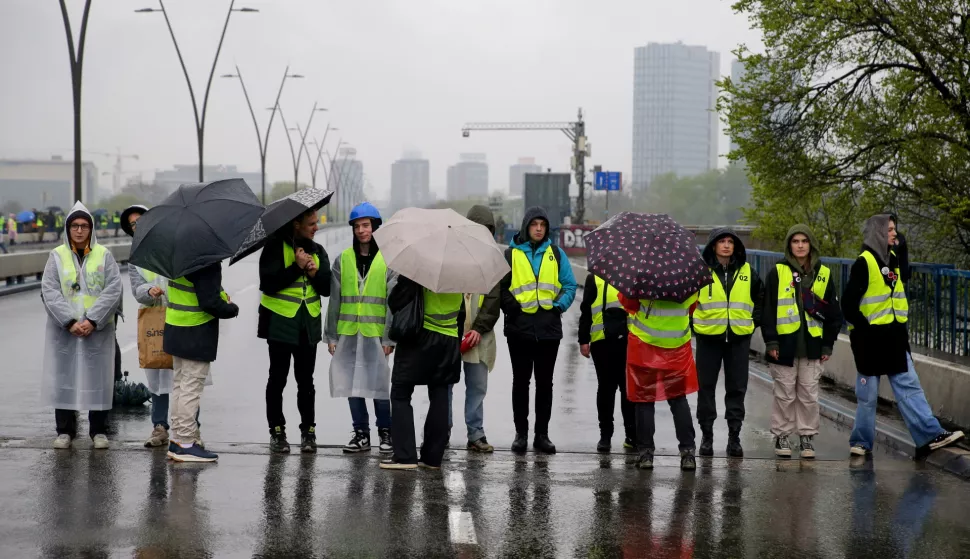 epa11989807 University students stage a blockade of the Brankova street bridge in Belgrade, Serbia, 26 March 2025. The students staged the protest, demanding accountability after fifteen people lost their lives in the collapse of the Novi Sad Railway Station canopy on 01 November 2024. The station building, which had been renovated and reopened on 05 July 2024, was undergoing further renovations shortly before the collapse. EPA/ANDREJ CUKIC