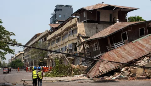 epa11998661 Rescuers walk next to the site of a collapsed building following an earthquake in Mandalay, Myanmar, 30 March 2025. More than 1,600 people have been killed and thousands injured after a 7.7-magnitude earthquake struck the country on 28 March, according to the Myanmar government. EPA/STRINGER