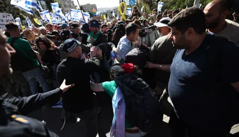 epa11973932 Police and demonstrators clash during a march to protest the resumption of fighting in Gaza and against Israeli Prime Minister Netanyahu's announced plans to dismiss Shin Bet chief Ronen Bar, in Jerusalem, 19 March 2025. EPA/ATEF SAFADI