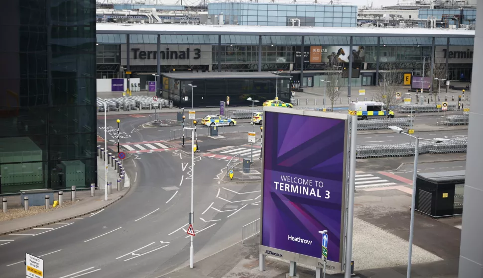 epa11977959 Police vehicles are parked outside an otherwise deserted Terminal 3 at Heathrow Airport in Hillingdon, London, Britain, 21 March 2025. Heathrow Airport on 21 March announced it would be closed all day, following a power outage 'due to a fire at an electrical substation supplying the airport'. EPA/TOLGA AKMEN