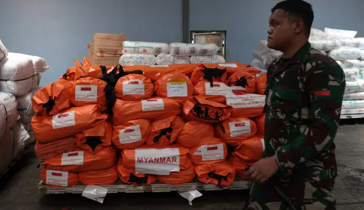 epa12004394 An Indonesian soldier walks past aid supplies during the preparation of an Indonesian Search and Rescue (SAR) team for deployment to earthquake-stricken Myanmar, at Halim Perdanakusuma Air Force base in Jakarta, Indonesia, 02 April 2025. The Indonesian government is sending humanitarian aid in the Myanmar earthquake disaster, including SAR teams, medical personnel, and logistics, with gradual delivery. EPA/ADI WEDA