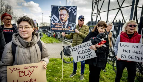 epa11997071 Demonstrators protest at the Tesla Delivery Center in Tilburg, The Netherlands, 29 March 2025. Critics of billionaire Elon Musk demonstrate at branches of his car company Tesla worldwide, calling on consumers to boycott the brand. EPA/ROBIN UTRECHT