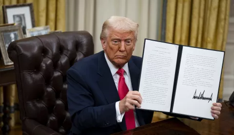 epa11945817 US President Donald Trump displayed a signed executive order in the Oval Office of the White House in Washington, DC, US, 06 March 2025. Trump signed executive orders to pause tariffs on USMCA trade from Canada and Mexico until 02 April 2025. EPA/AL DRAGO/POOL