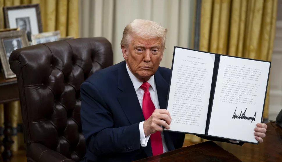 epa11945817 US President Donald Trump displayed a signed executive order in the Oval Office of the White House in Washington, DC, US, 06 March 2025. Trump signed executive orders to pause tariffs on USMCA trade from Canada and Mexico until 02 April 2025. EPA/AL DRAGO/POOL