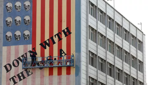 epa11996816 An Iranian painter repaints one of the famous anti-US murals in Tehran, Iran, 29 March 2025. The tension between the US and Iran is going on as, according to the Iranian foreign ministry, Iranian Foreign Minister Abbas Araghchi said on 28 March 2025 that Iran has responded to US President Donald Trump's letter about reaching a new nuclear agreement, through the Oman administration.  EPA/ABEDIN TAHERKENAREH