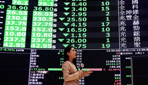 epa12015084 A reporter presents stock values inside the Taiwan Stock Exchange Office in Taipei, Taiwan, 07 April 2025. Taiwan's stock market was hit by intense stop-loss and panic selling, resulting in a staggering drop of 2,086 points, or more than 9.7 percent, the largest intraday loss in its history. The index reached a low of 19,212.02, while futures were locked at limit-down, and over 1,000 stocks hit their daily decline limit. EPA/RITCHIE B. TONGO