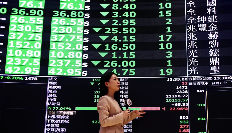 epa12015084 A reporter presents stock values inside the Taiwan Stock Exchange Office in Taipei, Taiwan, 07 April 2025. Taiwan's stock market was hit by intense stop-loss and panic selling, resulting in a staggering drop of 2,086 points, or more than 9.7 percent, the largest intraday loss in its history. The index reached a low of 19,212.02, while futures were locked at limit-down, and over 1,000 stocks hit their daily decline limit. EPA/RITCHIE B. TONGO