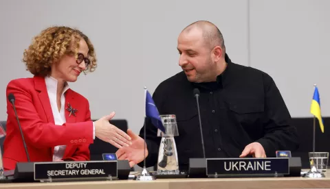 epa12022647 NATO Deputy Secretary General Radmila Shekerinska (L) and Ukrainian Defense Minister Rustem Umerov shake hands prior to a meeting of he Coalition of the Willing Defence Ministers for Ukraine at NATO Headquarters in Brussels, Belgium, 10 April 2025. EPA/OLIVIER HOSLET