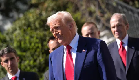 epa12021439 US President Donald Trump speaks as he participates in a photo opportunity with racing champions outside the White House in Washington, DC, USA, 09 April 2025. EPA/CHRIS KLEPONIS /POOL