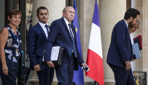 epa06909563 French Interior Minister Gerard Collomb (C), flanked by Overseas minister Annick Girardin (L) and Budget minister Gerald Darmanin (2-L), leaves the Elysee palace after the weekly cabinet meeting in Paris, France, 25 July 2018. EPA/CHRISTOPHE PETIT TESSON