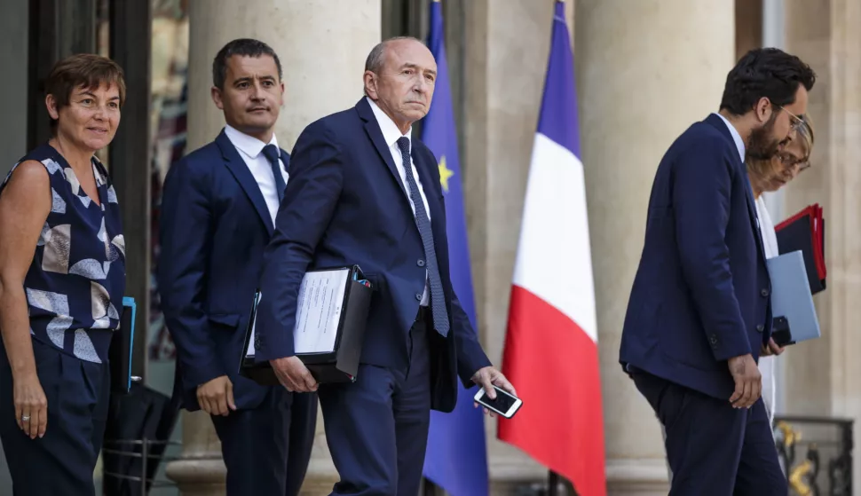 epa06909563 French Interior Minister Gerard Collomb (C), flanked by Overseas minister Annick Girardin (L) and Budget minister Gerald Darmanin (2-L), leaves the Elysee palace after the weekly cabinet meeting in Paris, France, 25 July 2018. EPA/CHRISTOPHE PETIT TESSON