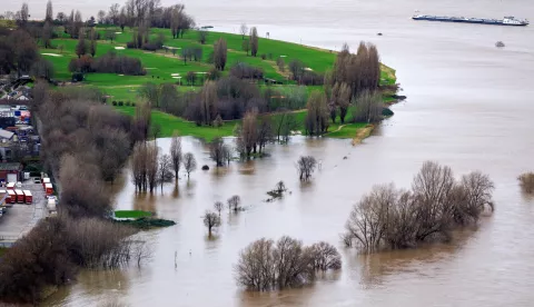 epa11058795 An aerial view shows an inundated area in the floodplains along the Rhine river, amidst high water levels, in Dusseldorf, Germany, 05 January 2024. The German Weather Service (DWD) warned that water levels remain high in some places in Germany after heavy rain during the Christmas period and warned of persistent rain in parts of Germany from 02 to 05 January that may increase the issue. EPA/CHRISTOPHER NEUNDORF
