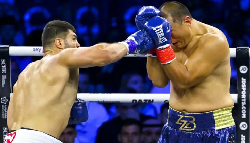 epa10131304 Filip Hrgovic of Croatia (L) in action against Zhang Zhilei of China during their heavyweight fight at the Jeddah Superdome, Saudi Arabia, 21 August 2022. The heavyweight fight is an IBF heavyweight championship eliminator, ahead of the main event fight between IBF, WBA and WBO titleholder Oleksandr Usyk and his challenger Anthony Joshua. EPA/ALI HAMED KHAMAJ