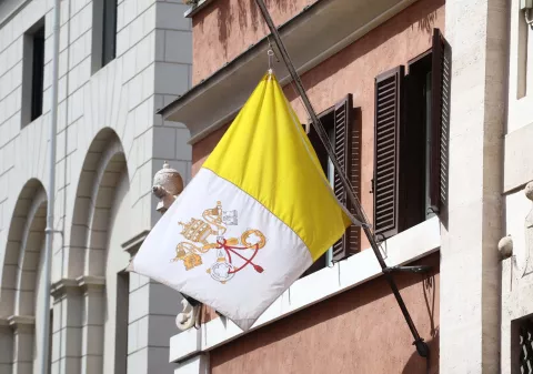 epa12044409 The Vatican flag flies at half-mast following the death of Pope Francis, at the entrance to the Swiss Guard barracks, Vatican City, 21 April 2025. Pope Francis died on 21 April 2025 at the age of 88, according to the Holy See. Born Jorge Mario Bergoglio in Buenos Aires, Argentina, on 17 December 1936, he was appointed leader of the Catholic Church on 13 March 2013, succeeding Pontiff Emeritus Benedict XVI. EPA/MASSIMO PERCOSSI