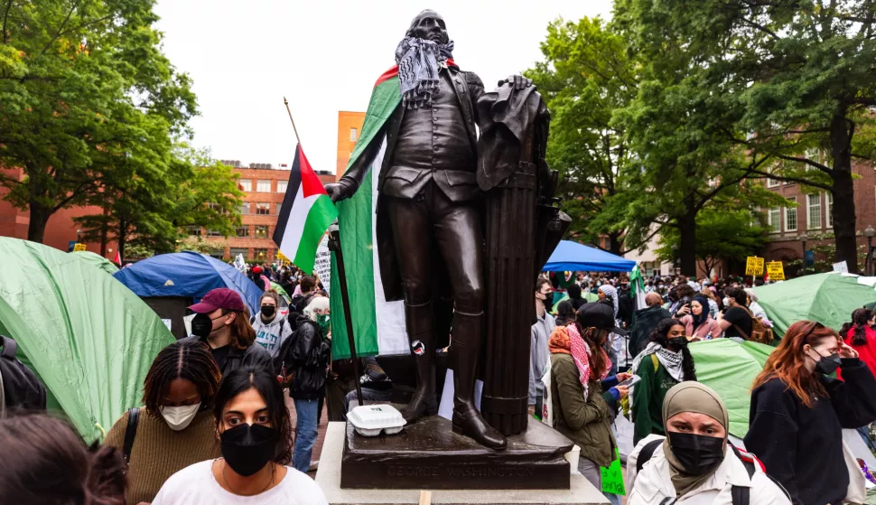 epa11301422 A statue of George Washington is adorned with Palestinian flags during a pro-Palestinian demonstration by college students at George Washington University (GWU), as they call on the university to divest from companies that provide arms to Israel in Washington, DC, USA, 25 April 2024. Protests against Israel's ongoing incursion into Gaza have erupted at college campuses across the US. More than 34,000 Palestinians and over 1,450 Israelis have been killed, according to the Palestinian Health Ministry and the Israel Defense Forces (IDF), since Hamas militants launched an attack against Israel from the Gaza Strip on 07 October 2023, and the Israeli operations in Gaza and the West Bank which followed it. EPA/JIM LO SCALZO