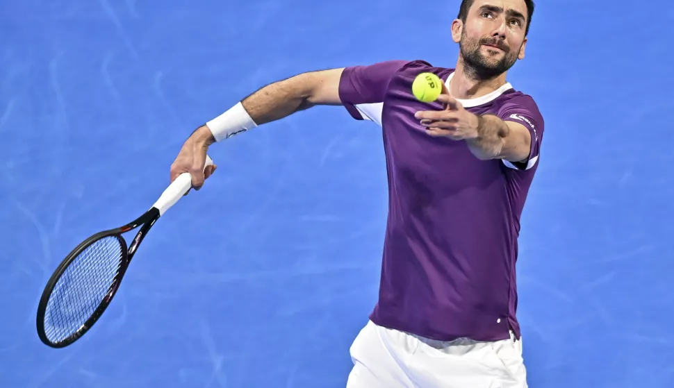 epa11903348 Marin Cilic of Croatia in action during his first round match against Carlos Alcaraz of Spain at the Qatar Open tennis tournament in Doha, Qatar, 17 February 2025. EPA/NOUSHAD THEKKAYIL