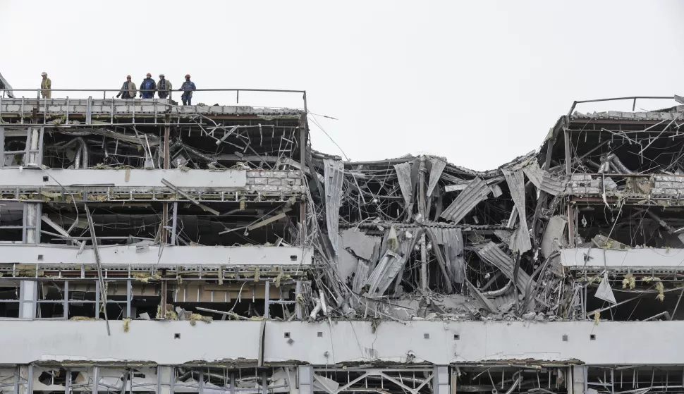 epa12013193 Ukrainian rescuers work at the site of a rocket hit in Kyiv, Ukraine, 06 April 2025, amid the ongoing Russian invasion. At least one person died and three other people were injured after an overnight combined rocket and shock drone attacks in Kyiv, according to the State Emergency Service report. Russian troops entered Ukrainian territory on 24 February 2022, starting a conflict that has provoked destruction and a humanitarian crisis. EPA/SERGEY DOLZHENKO