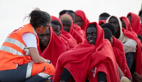 epa12030642 Migrants that were rescued are seen after they were taken to Puerto del Rosario (Fuerteventura), in the Canary Islands, Spain, 13 April 2025, where they were treated by Red Cross personnel. The Maritime Rescue vessel Guardamar Talia rescued a group of 50 people, 45 men, four women, and a minor who called for help from the inflatable boat on which they were trying to reach the Canary Islands. EPA/Carlos de Saa