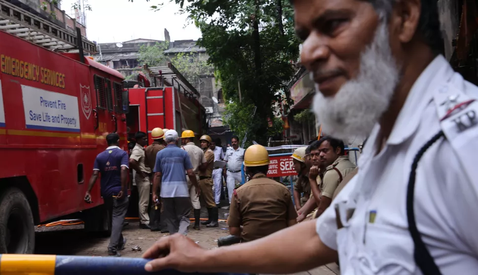 epa12064099 Indian firefighters work to extinguish a fire that broke out at a Rituraj Hotel in central Kolkata, India, 30 April 2025. At least 14 people were killed and several people were rescued in a fire at a hotel in central Kolkata, police said. EPA/PIYAL ADHIKARY