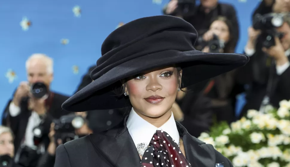 epa12076771 Rihanna poses on the red carpet for the 2025 Met Gala, the annual benefit for the Metropolitan Museum of Art's Costume Institute, in New York, New York, USA, 05 May 2025. The event coincides with the Met Costume Institute's spring 2025 exhibition 'Superfine: Tailoring Black Style' which will be on view from 10 May 2025 through 26 October 2025. EPA/JUSTIN LANE