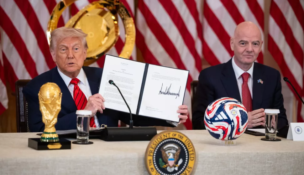 epa12078749 US President Donald Trump (L) holds up the charter of the White House Task Force on the FIFA World Cup 2026 next to FIFA President Gianni Infantino during a FIFA Task Force meeting in the East Room of the White House in Washington, DC, USA, 06 May 2025. Giuliani was named executive director of the task force. EPA/FRANCIS CHUNG/POOL