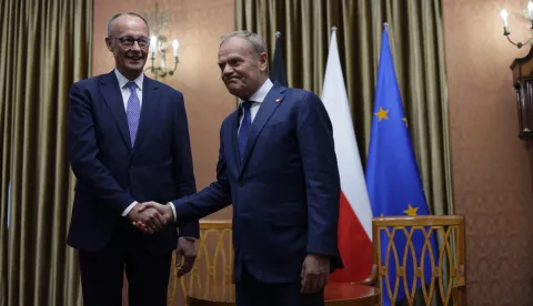 epa12081387 Polish Prime Minister Donald Tusk (R) meets with German Chancellor Friedrich Merz (L) at the prime minister's office in Warsaw, Poland, 07 May 2025. The German Chancellor visits France and Poland the day after his election. EPA/HANNIBAL HANSCHKE/POOL