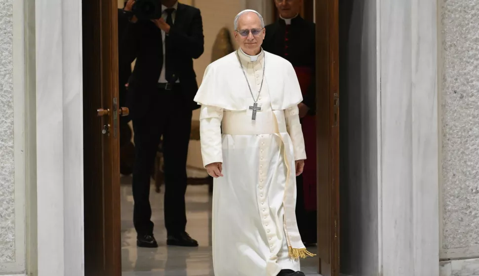 epa12093320 Pope Leo XIV arrives for an audience with members of the media at the Paul VI Audience Hall in Vatican City, 12 May 2025. EPA/ETTORE FERRARI