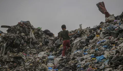 epa12093977 A Palestinian boy at a garbage dump in central Gaza City, 12 May 2025. More than 51,000 Palestinians have been killed in the Gaza Strip, according to the Palestinian Ministry of Health, since Israel launched a military campaign in the strip in response to a cross-border attack led by the Palestinian militant group Hamas on 07 October 2023, in which about 1,200 Israelis were killed and more than 250 taken hostage. EPA/MOHAMMED SABER