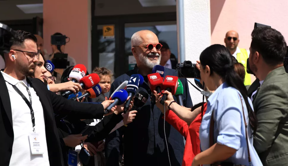 epa12090414 Albania's incumbent Prime Minister and Socialist Party of Albania (PS) chairman Edi Rama (C) speaks to the media after casting his ballot during the country's parliamentary elections in Tirana, Albania, 11 May 2025. Around 3.9 million eligible voters from both within the country and the diaspora are set to elect 140 members of Parliament, with incumbent prime minister Rama and his ruling Socialist Party (SP) seeking a fourth term. EPA/STRINGER