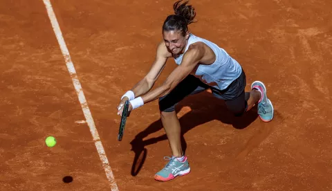 epa09168185 Petra Martic of Croatia in action during her first round match against Bernarda Pera of USA at the Mutua Madrid Open tennis tournament at Caja Magica, in Madrid, Spain, 29 April 2021. EPA/Juanjo Martin