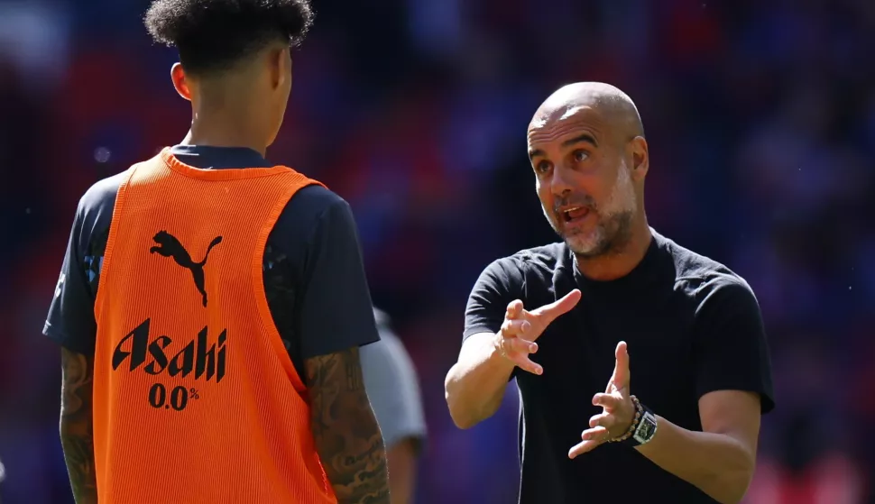 epa12109679 Manchester City's manager Pep Guardiola (R) speaks with his player Nico O'Reilly ahead of the FA Cup Final soccer match between Crystal Palace and Manchester City, in London, Britain, 17 May 2025. EPA/TOLGA AKMEN EDITORIAL USE ONLY. No use with unauthorized audio, video, data, fixture lists, club/league logos, 'live' services or NFTs. Online in-match use limited to 120 images, no video emulation. No use in betting, games or single club/league/player publications.