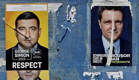 epa12102854 A billboard displays electoral posters of the candidates for the 2025 presidential election runoff, in Bucharest, Romania, 15 May 2025. The runoff for the 2025 Romanian presidential election will be held on 18 May between AUR party leader George Simion, who won the first round of the Romanian election rerun with 40.96 percent of the vote, and mayor of Bucharest Nicusor Dan. EPA/ROBERT GHEMENT