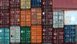 epa12119416 Containers are stacked at a transshipment terminal near Berlin, Germany, 20 May 2025. The German Council of Economic Experts is due to publish its Spring Report 2025 on 21 May 2025, which this year consists of the economic forecast for the years 2025 and 2026 as well as three other chapters. EPA/FILIP SINGER