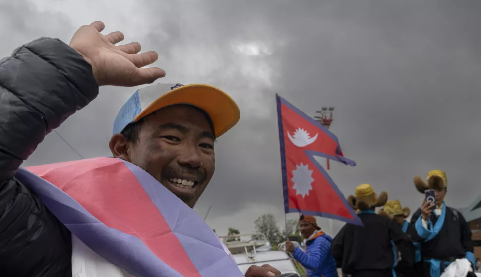 epa12137987 Nepalese mountaineer Tashi Gyalzen Sherpa (L) waves upon his arrival at Kathmandu Airport in Kathmandu, Nepal, 27 May 2025. Tashi, a professional mountaineer guide, has successfully climbed Mount Everest four times in 15 days, setting a new world record for the feat. He climbed Everest on 09, 14, 19, and 23 May 2025. EPA/NARENDRA SHRESTHA