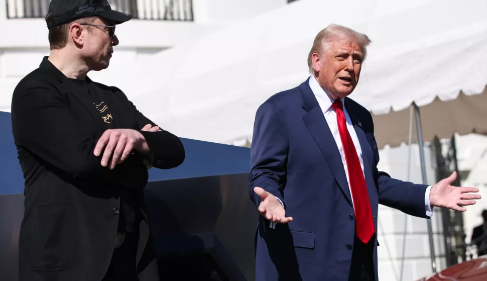 epa11957012 Tesla CEO and Senior Advisor to the President of the United States Elon Musk (L) looks on as US President Donald Trump (R) speaks in front of Tesla vehicles at the White House in Washington, D.C., USA, 11 March 2025. President Trump has said he will buy a Tesla to support Tesla and Elon Musk after recent attacks on Tesla charging stations and calls for boycotts of Tesla products. EPA/SAMUEL CORUM/POOL