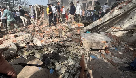 epa12171151 The site of a plane crash near Sardar Vallabhbhai Patel International Airport in Ahmedabad, Gujarat, western India, 12 June 2025. Air India flight AI171, bound for London carrying 242 passengers and crew members on board a Boeing 787-8 aircraft, crashed minutes after take-off in the Meghaninagar area of Ahmedabad. EPA/SIDDHARAJ SOLANKI 88168