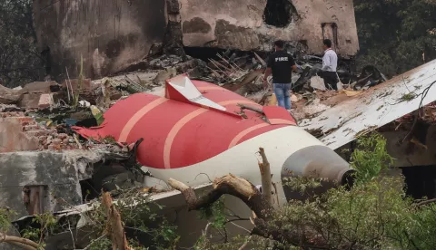 epa12172804 Officials inspects site of an airplane crash near Sardar Vallabhbhai Patel International Airport in Ahmedabad, Gujarat, western India, 13 June 2025. Air India flight AI171, bound for London carrying 242 passengers and crew members on board a Boeing 787-8 aircraft, crashed minutes after take-off in the Meghaninagar area of Ahmedabad. EPA/RAJAT GUPTA