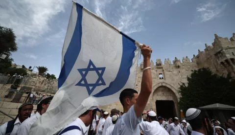 epa12136749 Right'wing Israelis gather before the Damascus Gate during the Israeli 'Flag March' in the Old City of Jerusalem, 26 May 2025. The annual right-wing Israeli 'Flag March' commemorates the establishment of Israeli control over the Old City of Jerusalem after the six-day war in 1967. Celebrating Jerusalem Day has long been viewed by Palestinians as a provocation. EPA/ATEF SAFADI