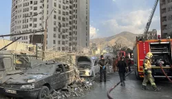 epaselect epa12172720 Fire fighters work outside a building that was hit by Israeli air strikes north of Tehran, Iran, 13 June 2025. Israel confirms it has launched strikes on Iran's 'nuclear program' as blasts are heard across the country. The strikes are part of Operation Rising Lion, Israel's Prime Minister Benjamin Netanyahu said, adding Iran was a threat to "Israel's very survival". EPA/ABEDIN TAHERKENAREH