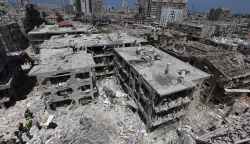 epa12176800 Members of Israel's Home Front Command search for missing people under the rubble of a partially collapsed residential building after Iranian ballistic missiles hit Bat Yam, central Israel, 15 June 2025. Iran launched a barrage of ballistic missiles at Israel overnight in retaliation for Israeli airstrikes on Iranian targets. Magen David Adom (MDA), Israel's national emergency services, reported at least six killed and dozens injured, including two in critical condition. EPA/ABIR SULTAN