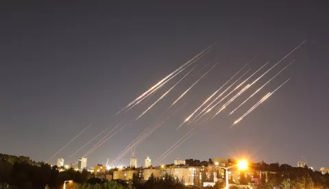 epa12175801 A slow exposure picture shows ballistic missiles above Jerusalem, 14 June 2025. Israel's military has identified missiles being launched from Iran towards the territory of Israel in retaliation following overnight airstrikes on Iranian targets. EPA/ABIR SULTAN