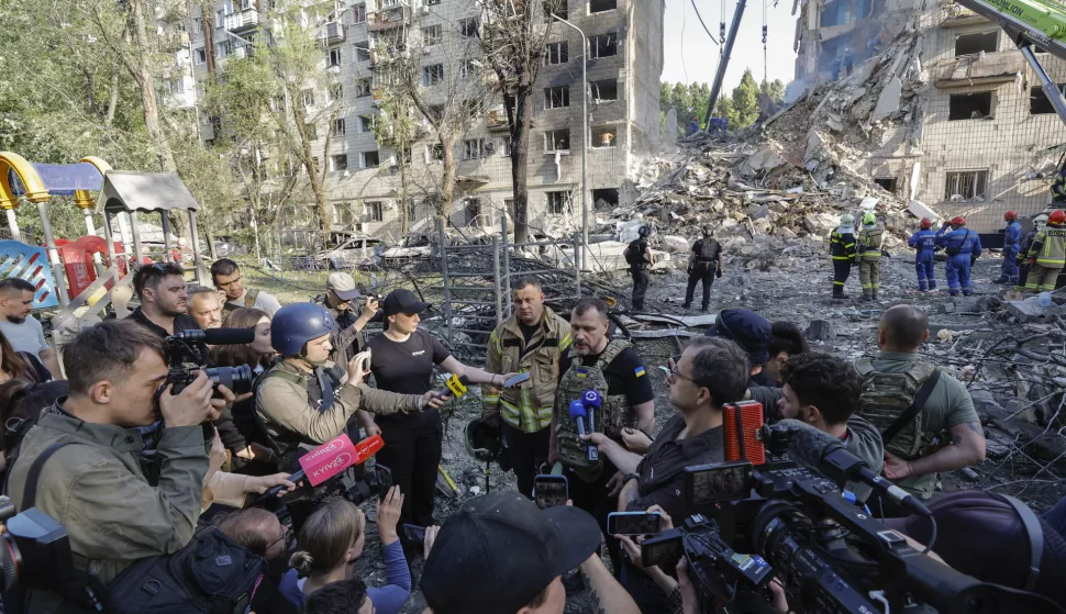 epa12180487 Ukrainian Minister of Internal Affairs Ihor Klymenko (C) speaks with journalists at the site of an airstrike on a nine-story residential building in Kyiv, Ukraine, 17 June 2025, amid the Russian invasion. At least 14 people were killed and 60 others injured after Russian forces launched a large-scale combined attack with at least 32 missiles and nearly 440 drones across Ukraine overnight, the State Emergency Service (SES) of Ukraine reported. EPA/SERGEY DOLZHENKO