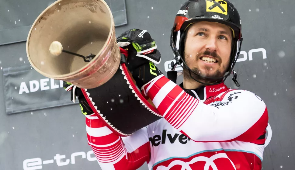 epa07279948 Marcel Hirscher of Austria celebrates with a cow bell on the podium after winning the men's Slalom race at the FIS Alpine Skiing World Cup in Adelboden, Switzerland, 13 January 2019. EPA/JEAN-CHRISTOPHE BOTT