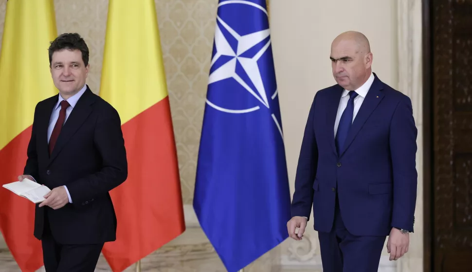 epa12187332 Romania's President Nicusor Dan (L) and designated Prime Minister Ilie Bolojan (R) arrive for a joint media statement at Cotroceni Presidential Palace in Bucharest, Romania, 20 June 2025. President Dan appointed Ilie Bolojan as prime minister-designate to form a government team and to appear before the Romanian Parliament for the vote of confidence. EPA/ROBERT GHEMENT