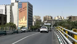 epa12190496 Traffic passes by a building displaying an anti-US mural in Tehran, Iran, 22 June 2025. The US forces struck three of Iran's key nuclear sites: Natanz, Isfahan and Fordo, US President Trump announced on 21 June. Israel and Iran have been exchanging fire since Israel launched strikes across Iran on 13 June 2025 as part of Operation 'Rising Lion.' EPA/ABEDIN TAHERKENAREH