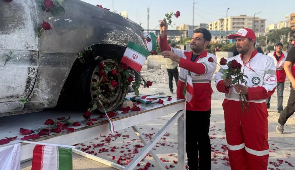 epa12192270 A handout picture provided by the Iranian Red Crescent Society (IRSC) shows members of the organisation placing flowers and petals on the Red Crescent vehicle which was attacked during the Israeli air strike on 19 June, in Tehran, Iran, 23 June 2025. US forces struck three of Iran's key nuclear sites: Natanz, Isfahan and Fordo, US President Trump announced on 21 June. Israel and Iran have been exchanging fire since Israel launched strikes across Iran on 13 June 2025 as part of Operation 'Rising Lion.' EPA/HANDOUT HANDOUT EDITORIAL USE ONLY/NO SALES