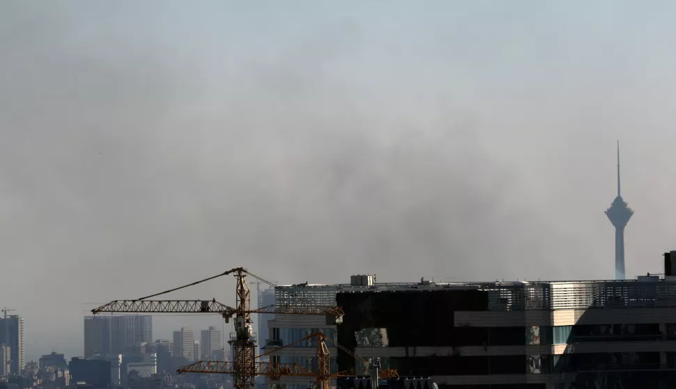 epa12183876 Smoke rises near the Milad Tower following an Israeli airstrike on Tehran, Iran, 18 June 2025. Israel and Iran have been exchanging fire since Israel launched strikes across Iran on 13 June 2025 as part of Operation 'Rising Lion.' EPA/ABEDIN TAHERKENAREH